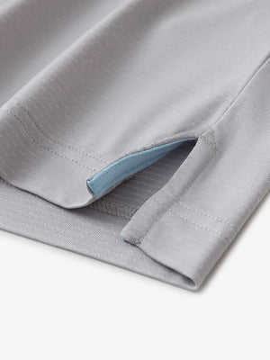 Detail of side slit hem on LIGHT GREY 4 Way Stretch Jacquard Polo — clean stitching and stretch finish