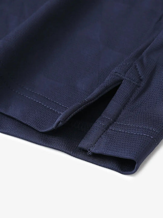 Close-up detail of hem opening on Modern Texture Stylish Polo in NAVY.