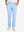 Front lower body view of model with hand in pocket, wearing quick dry casual dress pants in light blue.