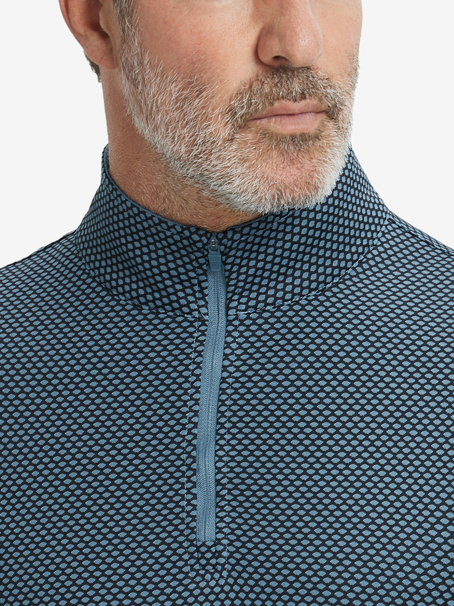 Close-up of collar area on jacquard quarter zip pullover in black/blue, highlighting refined jacquard detail.