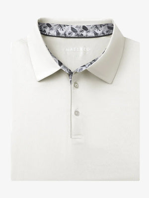 Folded Cream Everyday Classic Solid Polo neatly laid out for display