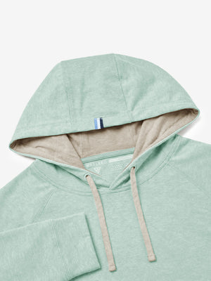 Close-up detail of hood structure, heather midlayer golf hoodies in light green heather