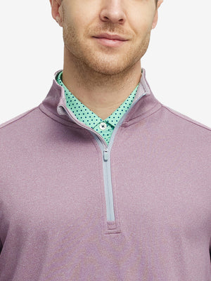 Front view from nose to chest of model wearing dusty rose melange moisture wicking quarter zip pullover