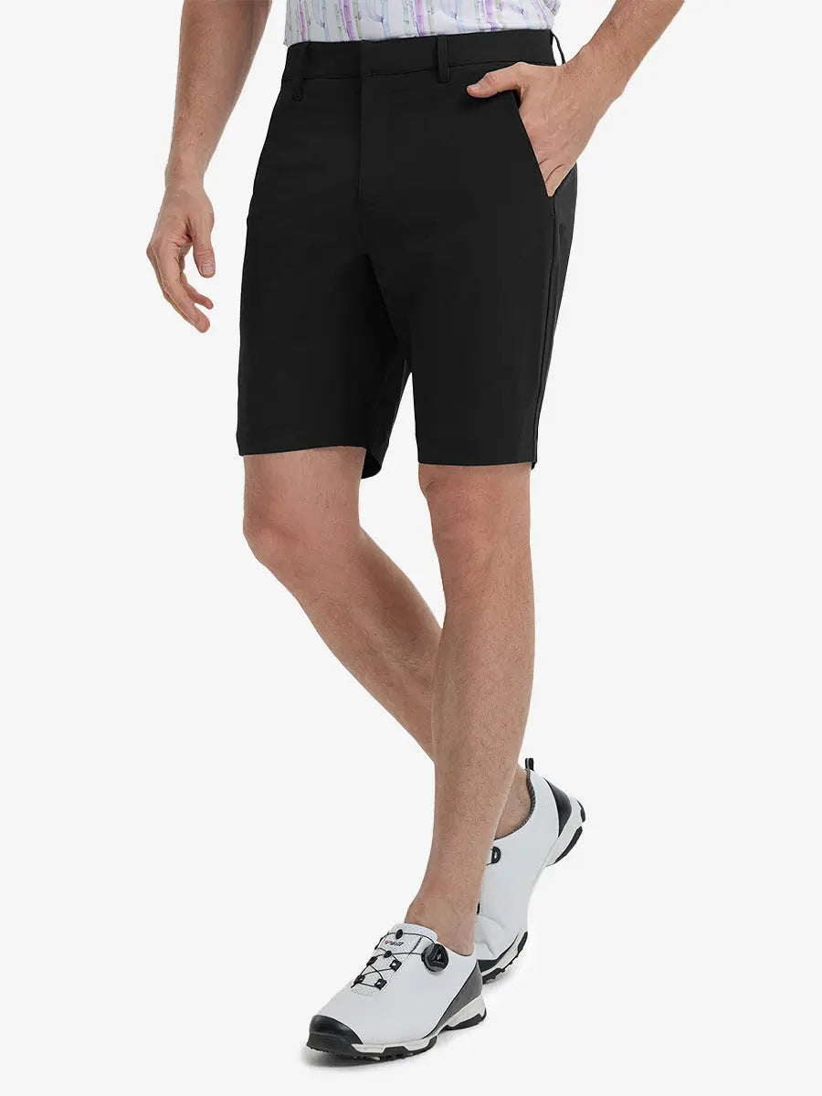 Front view of model’s lower body with hands in pockets, wearing Player Fit Versatile Solid Shorts 9 Inch – BLACK