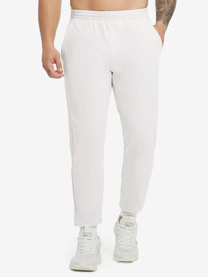 Model wearing Water Resistant Comfy Fleece Golf Joggers in oyster grey, lower body front view