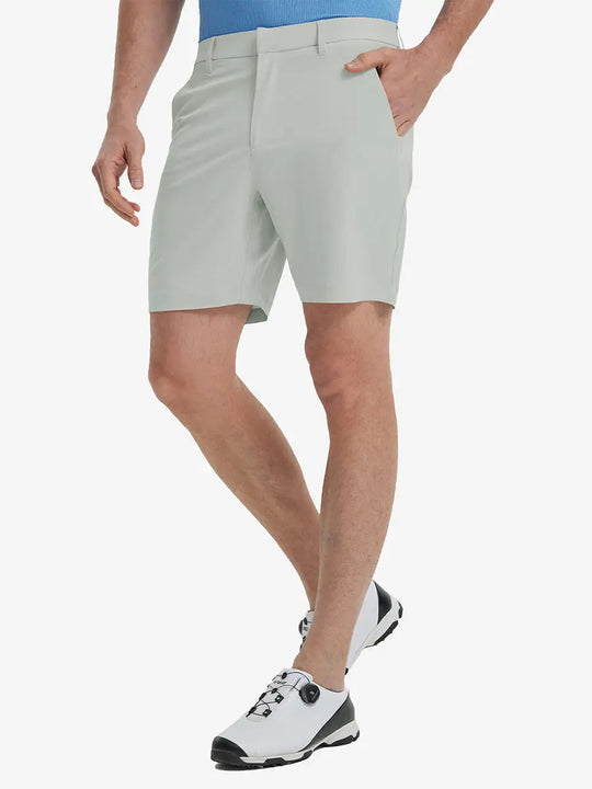 Front view of model’s lower body with hands in pockets, wearing Player Fit Versatile Solid Shorts 7 Inch – GLACIER GREY