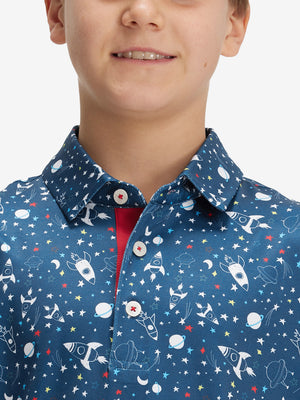 Close-up: nose to chest in space rocket performance print boys golf polo