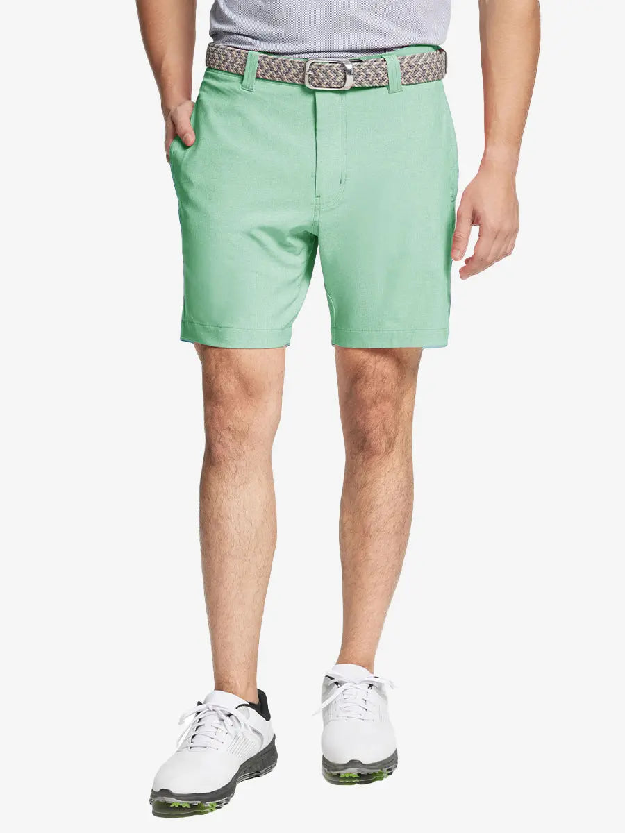 MINT GREEN 7 Inch Heather Performance Golf Shorts with front view, model's lower body and side pockets visible