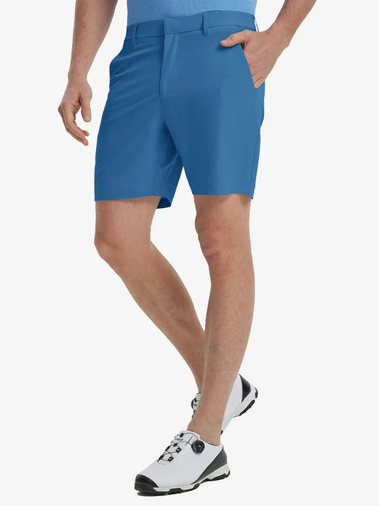 Front view of model’s lower body with hands in pockets, wearing Player Fit Versatile Solid Shorts 7 Inch – BLUE