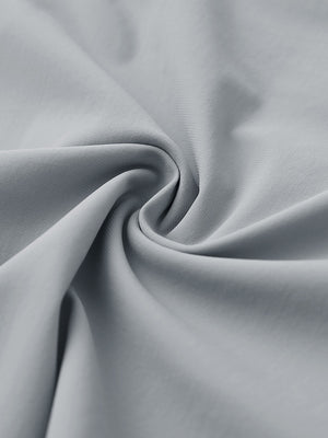 Close-up of quick dry casual shorts with 4 pockets fabric, breathable light grey texture with smooth finish