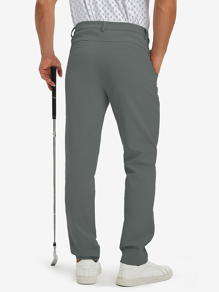 3D back view of lightweight moisture wicking dress pants on model holding golf club in slate green.
