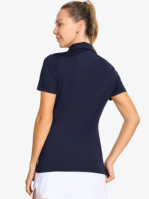 Back-side half-body shot of model in NAVY Women's Performance Solid Polo, looking over shoulder