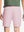 Back waist to knee view of pink water resistant golf 7 inch shorts, flexible performance fit.