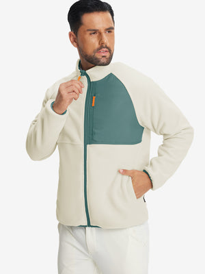 Model wearing the reversible fleece jacket with 5 pockets in beige, casually posing with one hand in the pocket for a stylish, practical look.