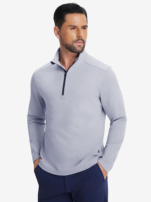 Front upper body shot of model in navy two tone pique cotton blend q-zip