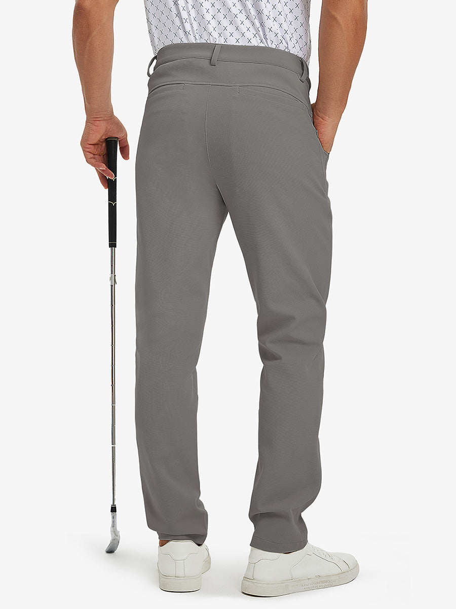 3D back view of lightweight moisture wicking dress pants on model holding golf club in dark khaki.