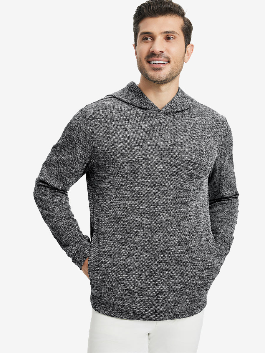 Model front upper body, one hand in pocket, wearing texture solid hoodies pullover, black heather.