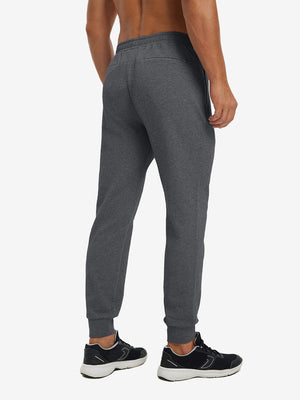 Back lower body view showing grey heather soft sweatpants with 4 zipper pockets