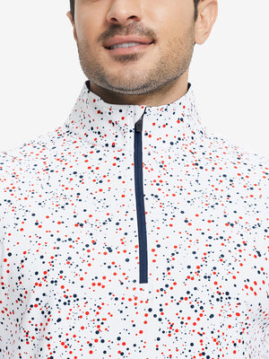 Upper front detail of Full print lightweight quarter zip pullover showing white polka dots accents