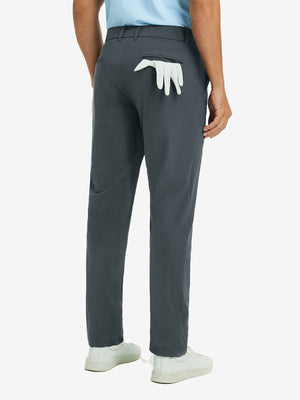 Back view of dark grey quick dry casual dress pants, golf glove tucked in rear pocket for sporty touch.