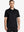 Front half-body view of male model in the Black Everyday Classic Solid Polo, standing still