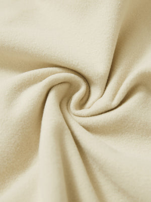Fabric close-up of light khaki water resistant comfy fleece golf joggers, soft fleece texture with water-resistant finish.