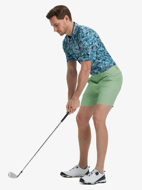 Full-body front shot of model holding golf club, wearing Player Fit Versatile Solid Shorts 7 Inch – BERYL GREEN
