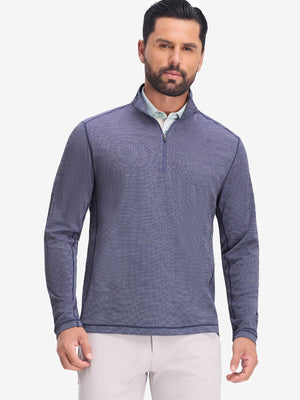 Front upper body shot of model wearing light dark blue grid featherweight midlayer quarter zip pullover