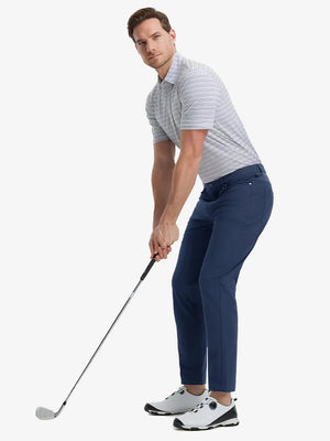 Full-body front shot with golf club, styled in Stretch Plain Everyday Pants – NAVY
