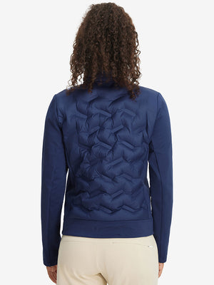 Back upper-body view of women's lightweight fleece-lined puffer jacket on model in navy.