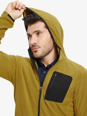 Model wearing hood and pulling it slightly, dressed in full zip fleece hoodied jacket in yellow.