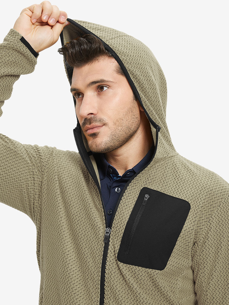 Model wearing hood and pulling it slightly, dressed in full zip fleece hoodied jacket in desert yellow.