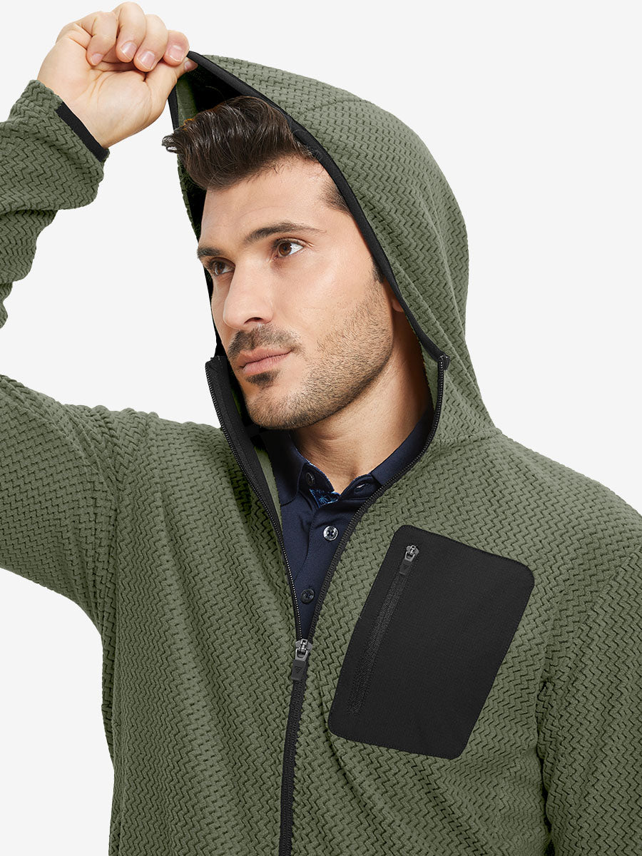 Model wearing hood and pulling it slightly, dressed in full zip fleece hoodied jacket in green.