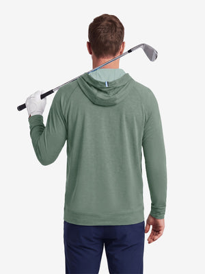 Model back upper body display shot, heather midlayer golf hoodies in celadon green heather