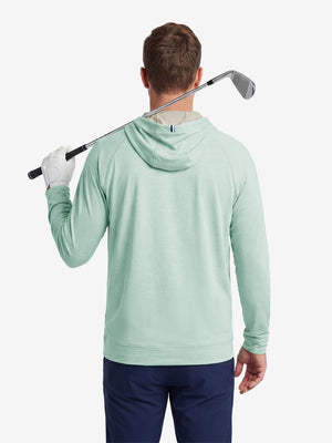 Model back upper body display shot, heather midlayer golf hoodies in light green heather