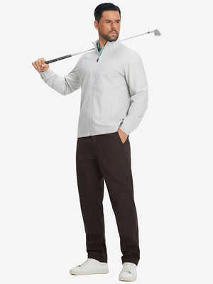 Full-body shot of model holding a golf club while wearing coffee brown thermal water repellent fleece dress pants