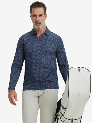 Model carrying golf bag, styled in navy pink seagull lightweight print long sleeve polo, sleek golf outfit.