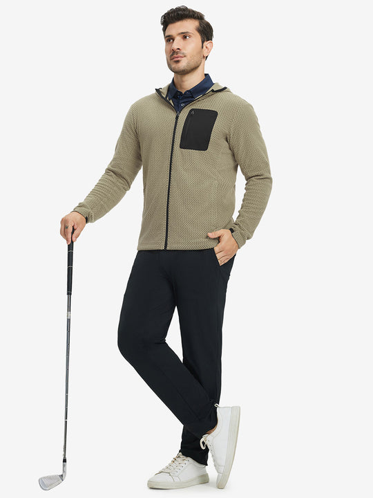 Model holding golf club, dressed in full zip fleece hoodied jacket in desert yellow, sporty and casual.
