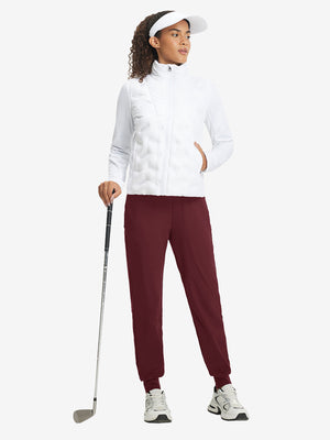 Full-body front view of model wearing women's stretch fleece lined water resistant joggers in wine.