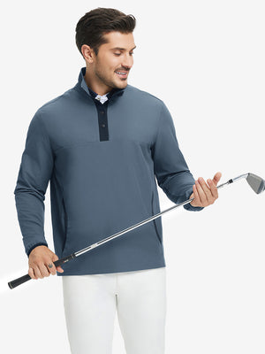 Model holding golf club, wearing mock neck quarter button golf pullover in misty blue, sporty look.