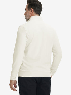 Back upper body view of the cream lightweight golf pullover, model turns head slightly with ease.