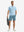 Full-body front view of model wearing the blue stretch soft flat front dress golf shorts for a complete look