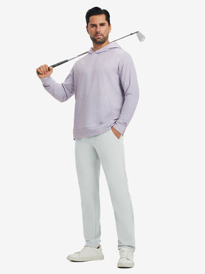 Model holding a golf club on shoulder, wearing glacier grey water-resistant golf stretch nylon pants.