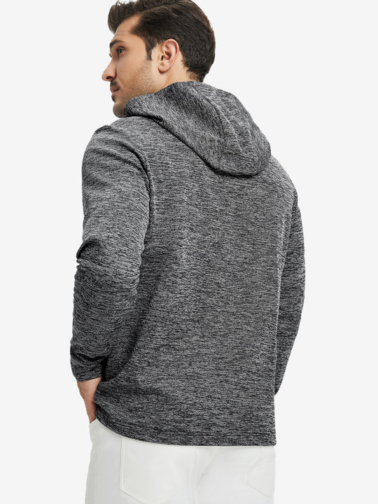 Back view of model wearing texture solid hoodies pullover showing fit and hood detail, black heather.