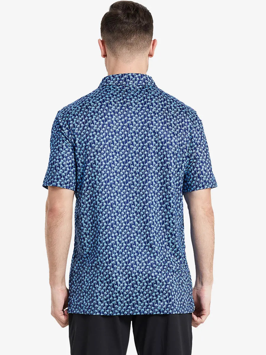 The back view shows the navy blue palm tree patterned model polo shirt, which brings tropical flavor and sporty energy for golf occasions.