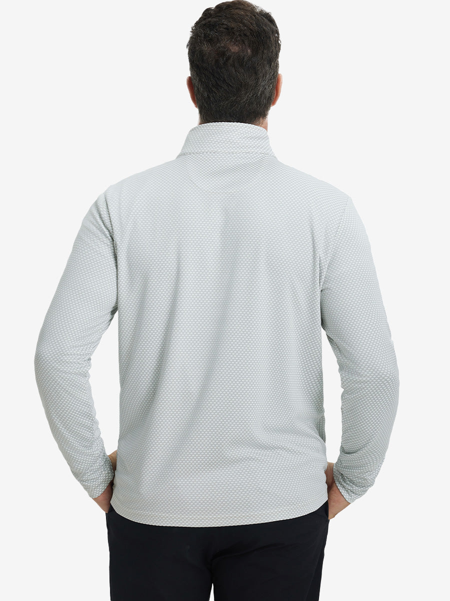 Back upper view of model wearing jacquard quarter zip pullover in light grey, showing clean seam lines.