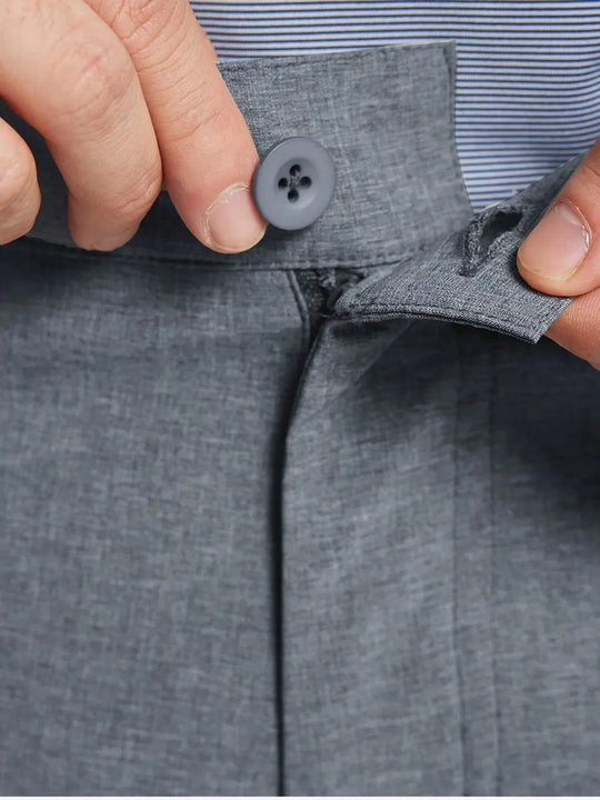 NAVY 9 Inch Heather Performance Golf Shorts close-up of waistband and button detail