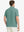 Rear view of Everyday Solid Jersey Polo in BERYL GREEN, highlighting clean back fit on model.