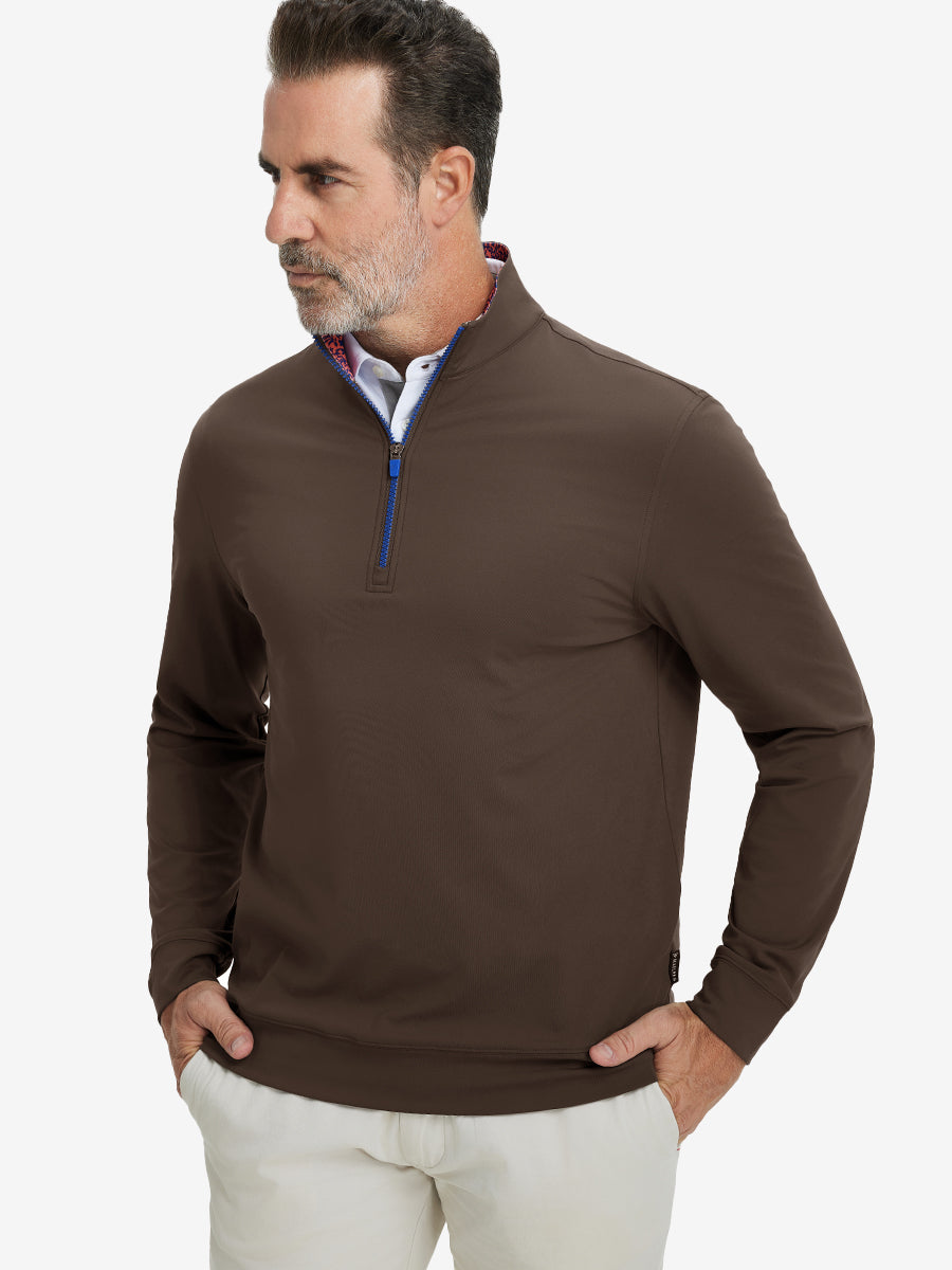 Front upper body view of model wearing lightweight golf quarter zip pullover in coffee brown, relaxed fit.