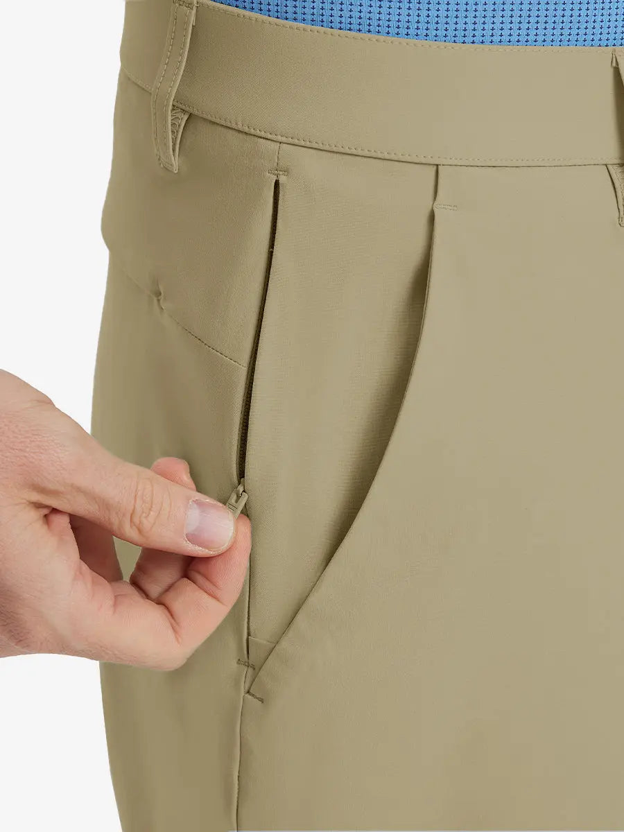 Close-up of right front pocket with zipper being opened on Player Fit Versatile Solid Shorts 7 Inch – KHAKI
